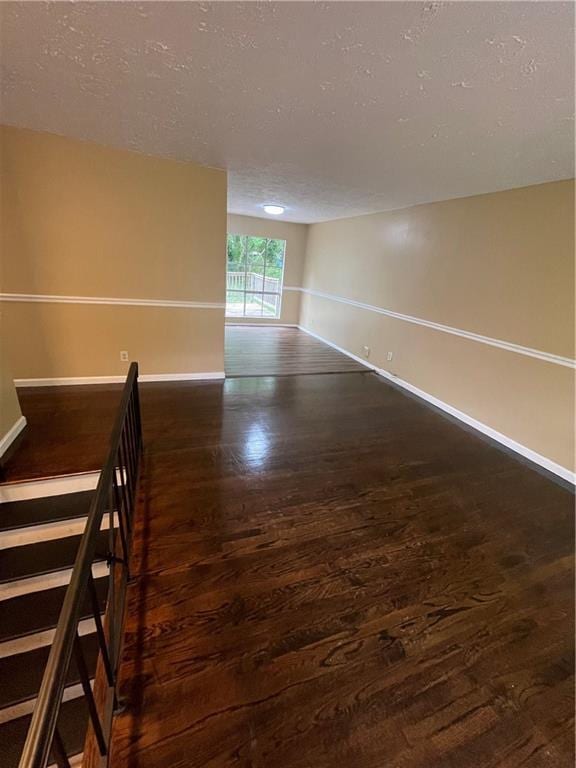 6399 Boca Grande Blvd, Forest Park, GA 30297 - spare room with wood finished floors, baseboards, and a textured ceiling