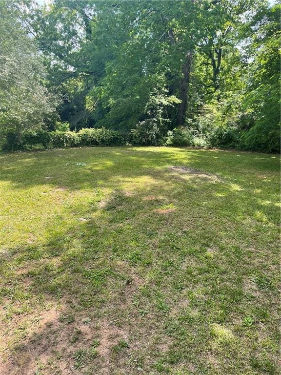 6399 Boca Grande Blvd, Forest Park, GA 30297 - view of grassy yard featuring a wooded view