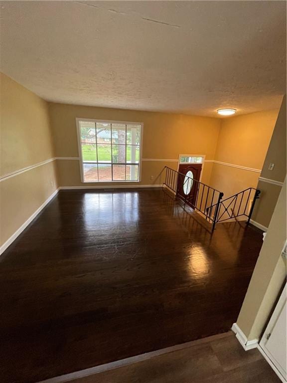 6399 Boca Grande Blvd, Forest Park, GA 30297 - empty room featuring baseboards, wood finished floors, and a textured ceiling
