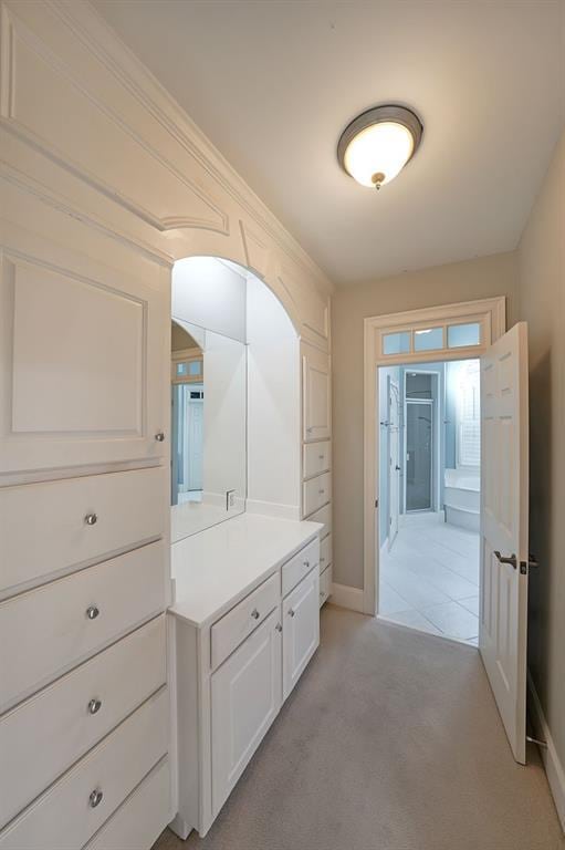 bathroom with walk in shower and vanity