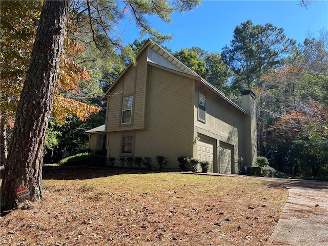 view of property exterior featuring a garage