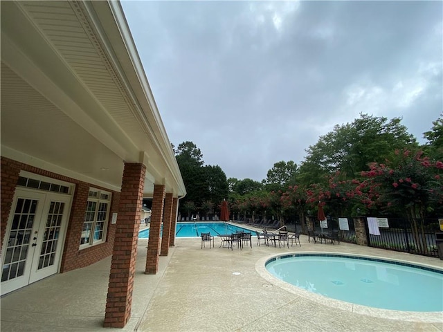 view of swimming pool featuring a patio area