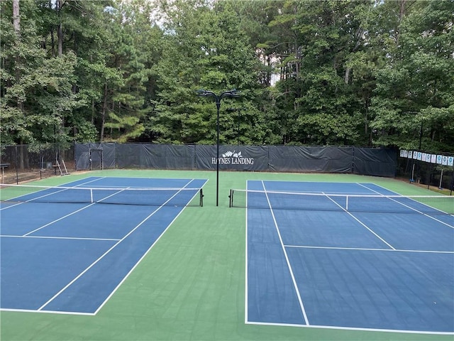 view of sport court featuring basketball hoop