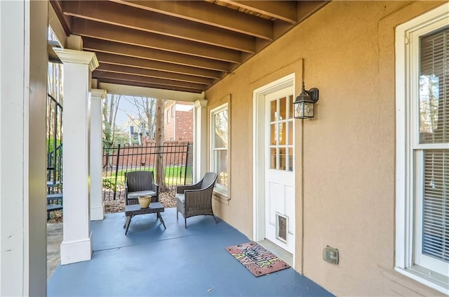 view of patio / terrace featuring fence