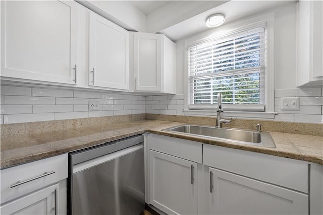 kitchen with white cabinetry, sink, tasteful backsplash, and dishwasher