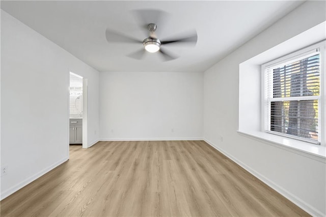 unfurnished room featuring light hardwood / wood-style floors and ceiling fan