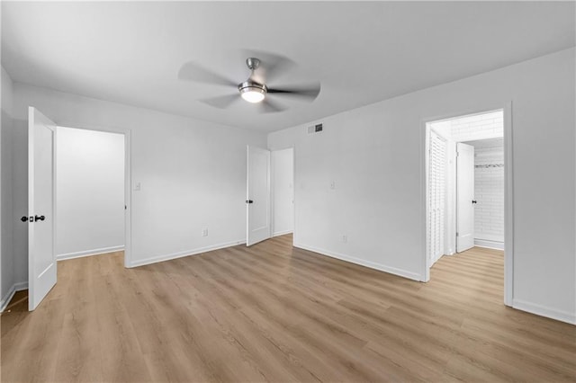 unfurnished bedroom featuring light hardwood / wood-style floors and ceiling fan