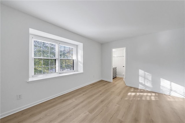 unfurnished room featuring light hardwood / wood-style floors