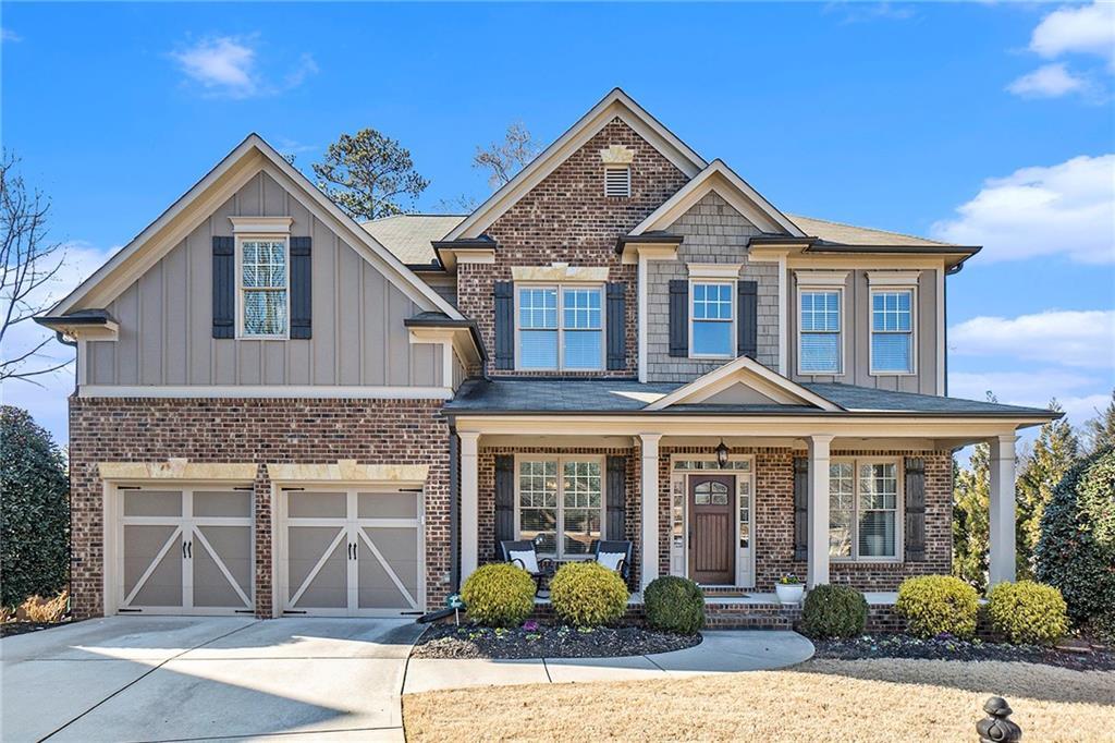 view of front of home featuring a garage and a porch