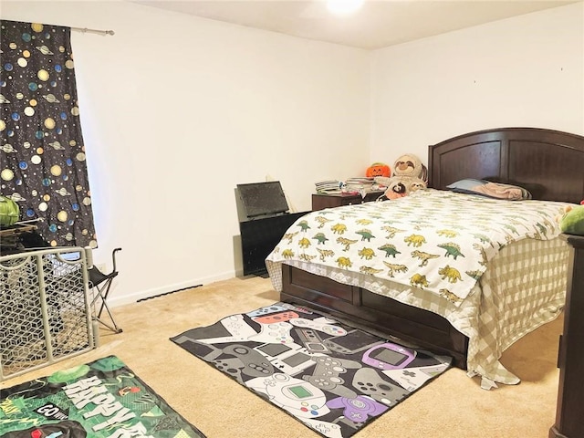 bedroom with light colored carpet