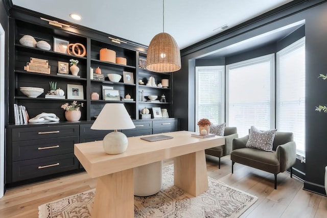 home office with ornamental molding, light hardwood / wood-style floors, and plenty of natural light