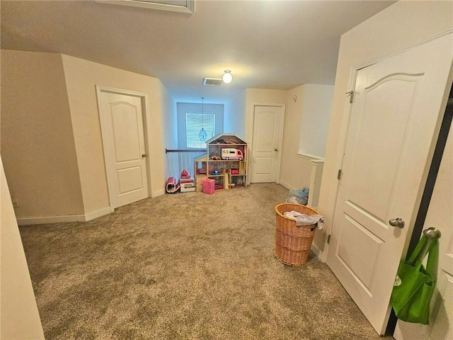 rec room with carpet floors and baseboards