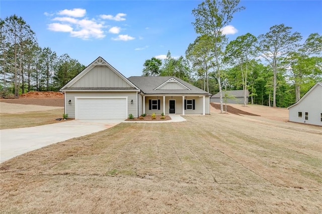 view of front of home with a porch and a garage