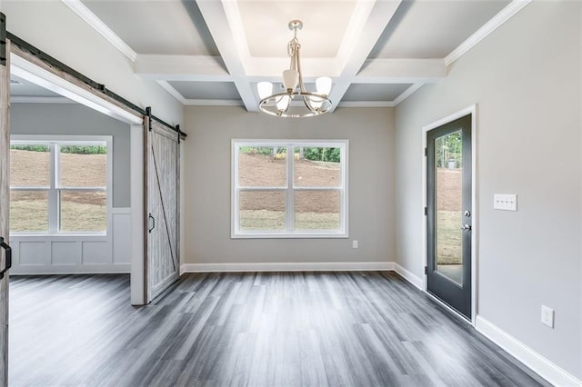 unfurnished dining area featuring coffered ceiling, a barn door, beam ceiling, dark hardwood / wood-style flooring, and a chandelier