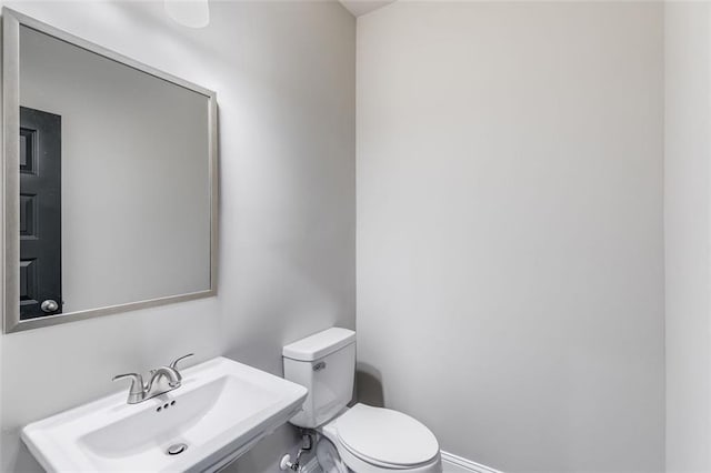 bathroom with sink and toilet