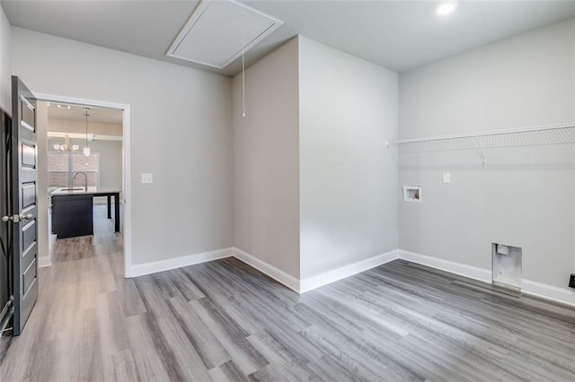 clothes washing area with washer hookup and hardwood / wood-style flooring