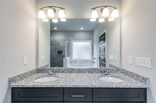 bathroom featuring vanity and shower with separate bathtub