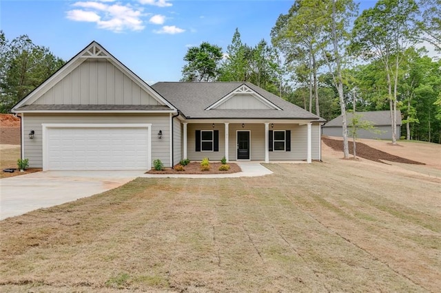 view of front of property with a porch and a garage