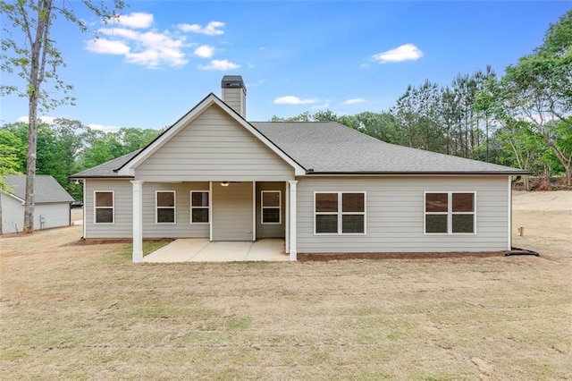 rear view of house with a patio