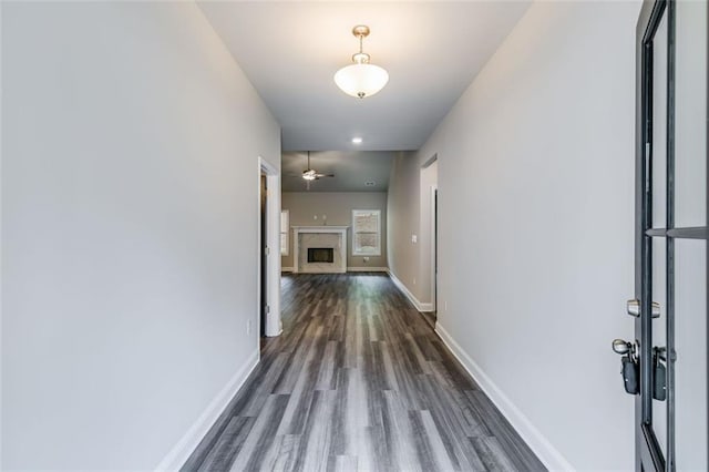 corridor with dark hardwood / wood-style flooring