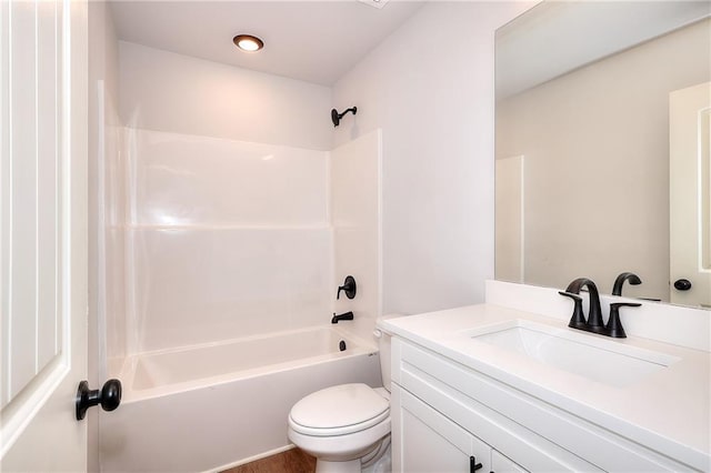 bathroom with toilet, vanity, and bathtub / shower combination