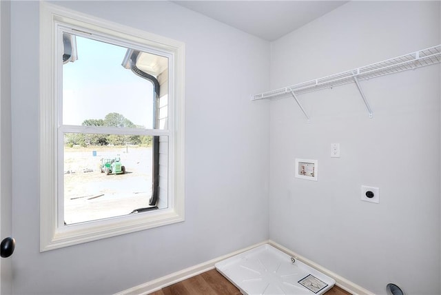 clothes washing area featuring washer hookup, laundry area, baseboards, and electric dryer hookup