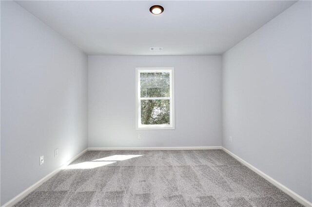 empty room featuring light carpet