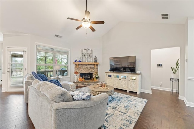 living room featuring dark hardwood / wood-style flooring, a fireplace, lofted ceiling, and ceiling fan