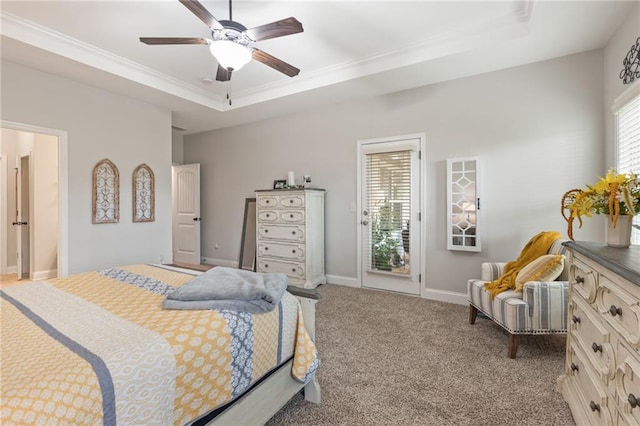 carpeted bedroom with ceiling fan, ornamental molding, access to exterior, and a raised ceiling