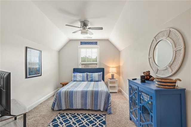 bedroom with ceiling fan, vaulted ceiling, and carpet