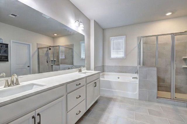 bathroom featuring tile patterned flooring, vanity, and independent shower and bath