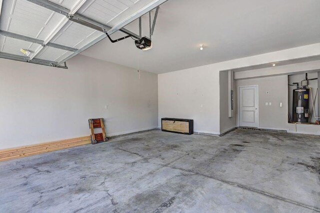 garage with a garage door opener and water heater