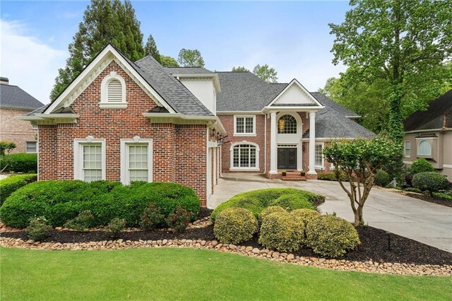 640 Greenview Ter, Milton, GA 30004 - view of front of house with brick siding, a front lawn, and roof with shingles