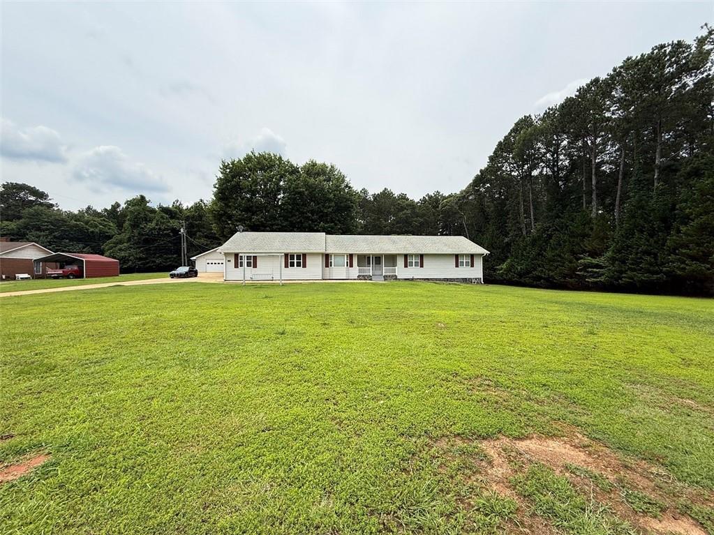 95 Oak Grove Cir, Mcdonough, GA 30253 - ranch-style house featuring a front lawn