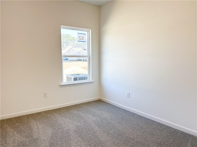 empty room featuring carpet flooring and a healthy amount of sunlight