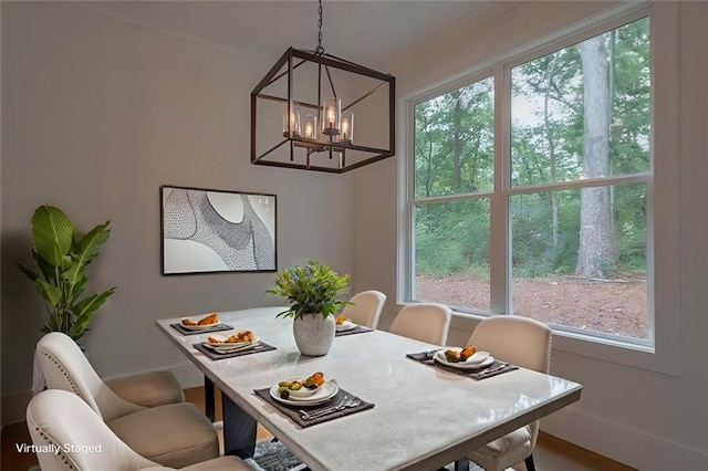 dining room with a notable chandelier