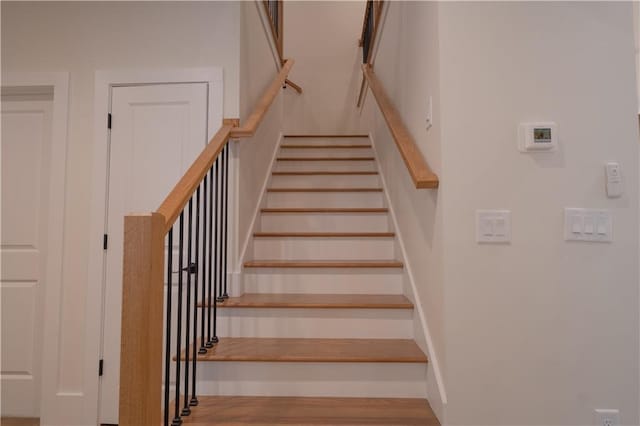 stairway with wood-type flooring