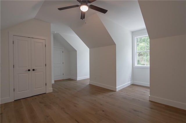 bonus room featuring vaulted ceiling, ceiling fan, and light hardwood / wood-style floors