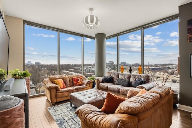 sunroom with a city view and plenty of natural light