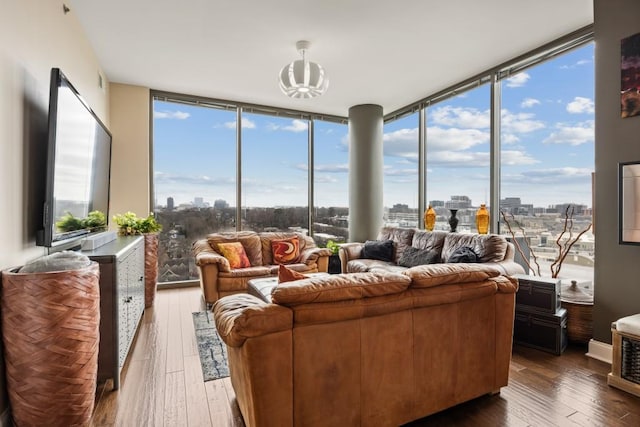 living area featuring floor to ceiling windows and hardwood / wood-style flooring