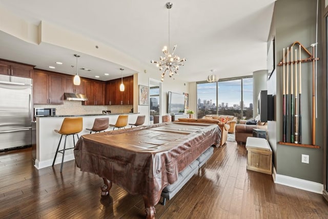 recreation room with baseboards, dark wood-style flooring, pool table, floor to ceiling windows, and a notable chandelier