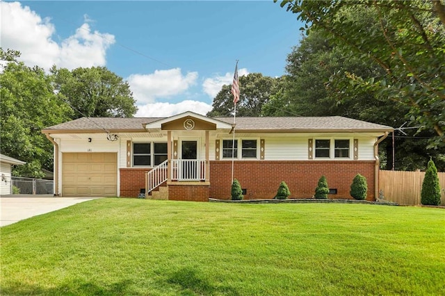 ranch-style house featuring a garage and a front lawn