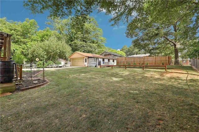 view of yard with an outbuilding and a garage