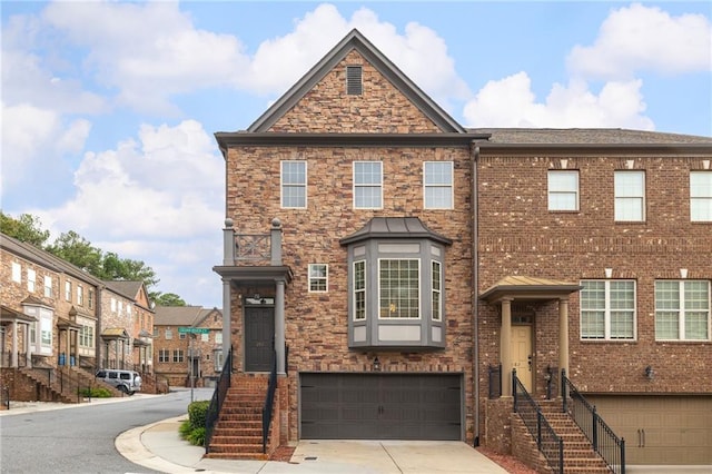 townhome / multi-family property featuring a garage