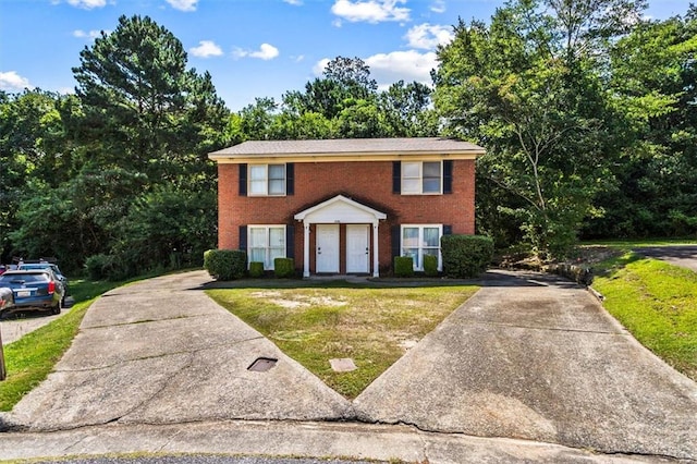4146 Monclair Dr, Columbus, GA 31907 - colonial inspired home featuring driveway, a front yard, and brick siding