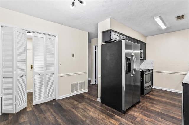 4146 Monclair Dr, Columbus, GA 31907 - kitchen with appliances with stainless steel finishes, dark wood-type flooring, dark cabinetry, and light countertops