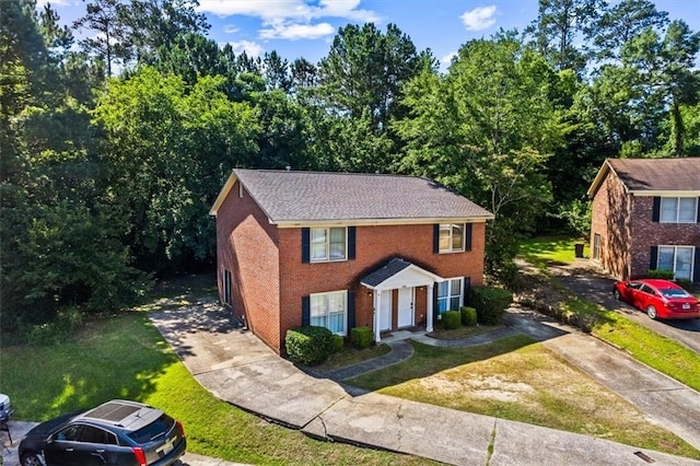 4146 Monclair Dr, Columbus, GA 31907 - colonial-style house featuring concrete driveway, a front lawn, and brick siding