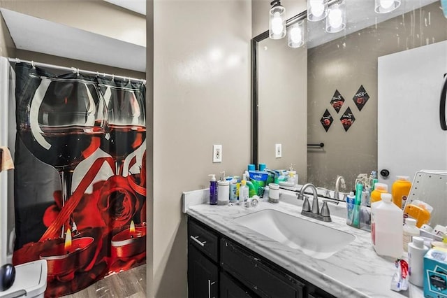4146 Monclair Dr, Columbus, GA 31907 - bathroom featuring vanity, wood finished floors, and curtained shower