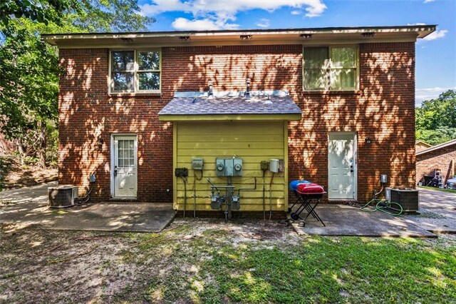 4146 Monclair Dr, Columbus, GA 31907 - rear view of house with brick siding and a patio area