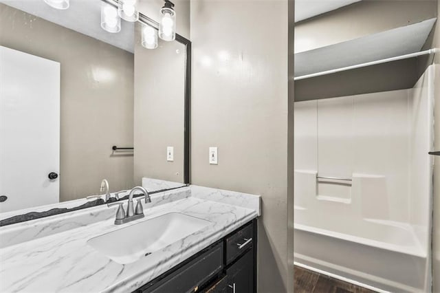 4146 Monclair Dr, Columbus, GA 31907 - bathroom featuring vanity, wood finished floors, and bathing tub / shower combination